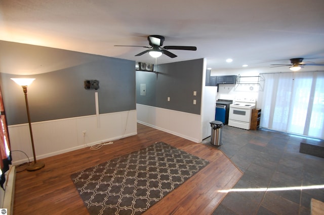 interior space featuring ceiling fan and dark wood-type flooring