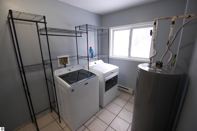 clothes washing area featuring washing machine and clothes dryer, light tile patterned floors, gas water heater, and a baseboard heating unit