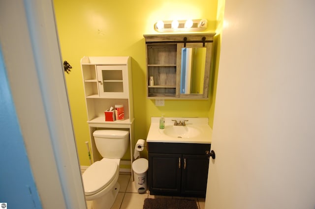 bathroom with tile patterned floors, vanity, and toilet