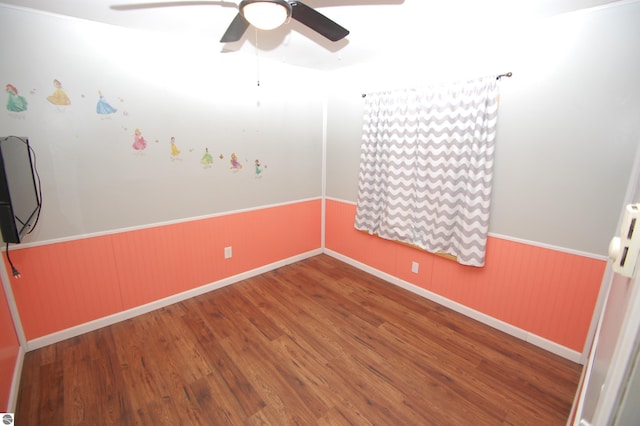 interior space featuring wood-type flooring and ceiling fan