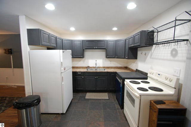 kitchen with gray cabinets, white appliances, and sink