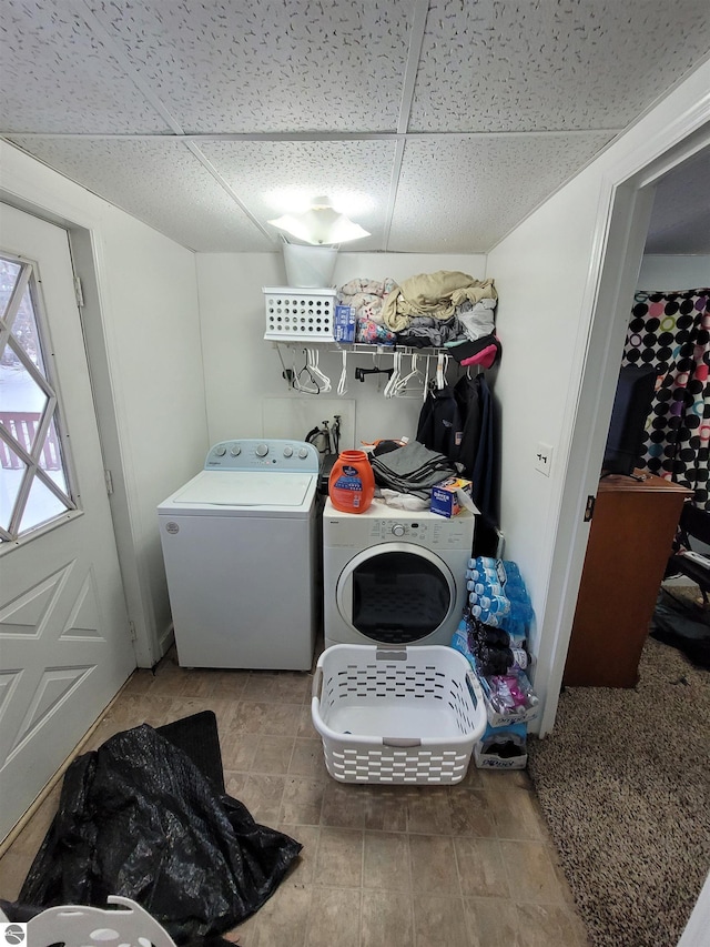 laundry area with washing machine and clothes dryer