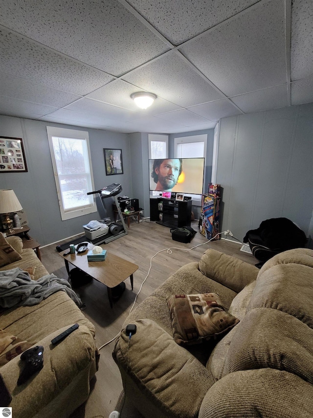 living room featuring a paneled ceiling