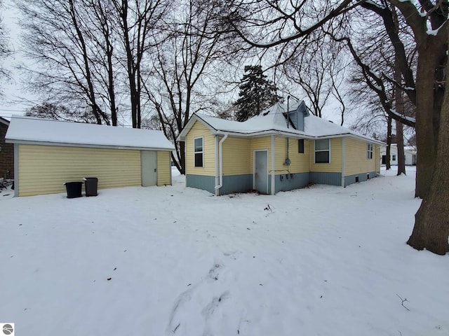 view of snow covered house