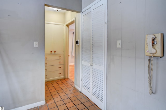 hallway with light tile patterned floors