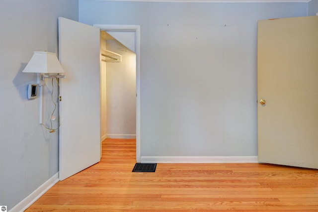 empty room with light hardwood / wood-style floors