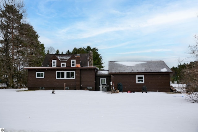 view of snow covered house