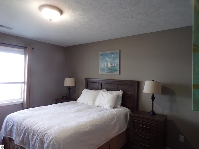 bedroom featuring a textured ceiling