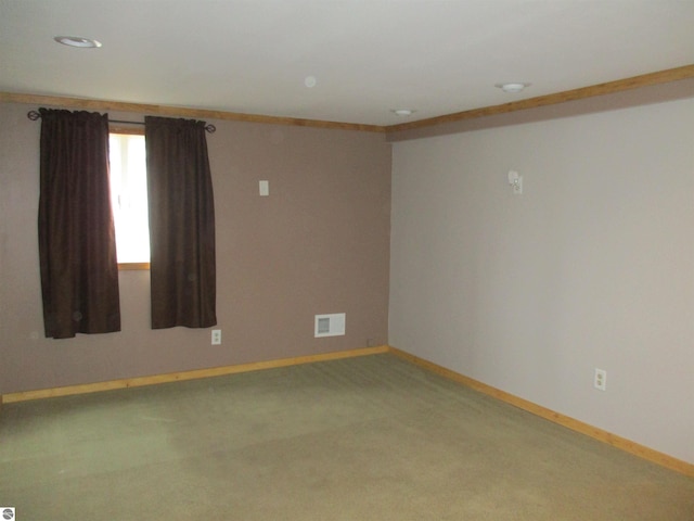 unfurnished room featuring carpet and ornamental molding