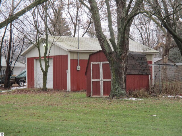 view of outdoor structure featuring a lawn