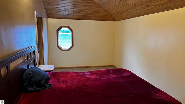 carpeted bedroom with wood ceiling and vaulted ceiling