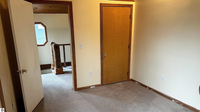 spare room with light colored carpet