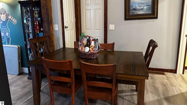 dining space featuring hardwood / wood-style floors