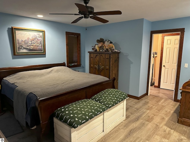 bedroom featuring ceiling fan and light hardwood / wood-style flooring