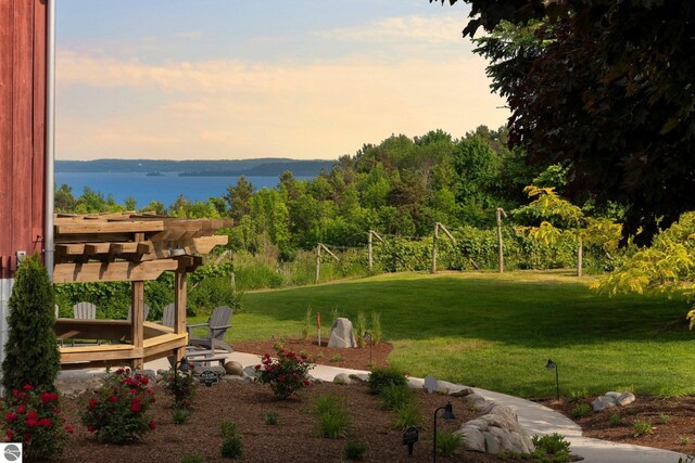 10343 E Hilltop Rd, Suttons Bay, MI 49682 - surrounding community with a lawn, a pergola, and a water and mountain view