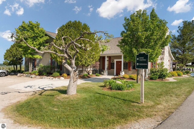 10343 E Hilltop Rd, Suttons Bay, MI 49682 - view of front of property featuring a front lawn