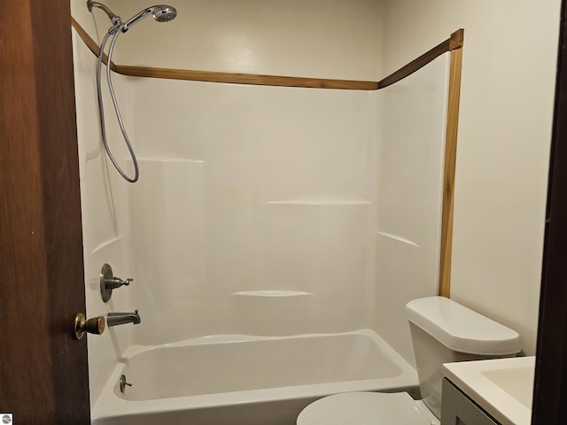 full bathroom featuring bathtub / shower combination, vanity, and toilet