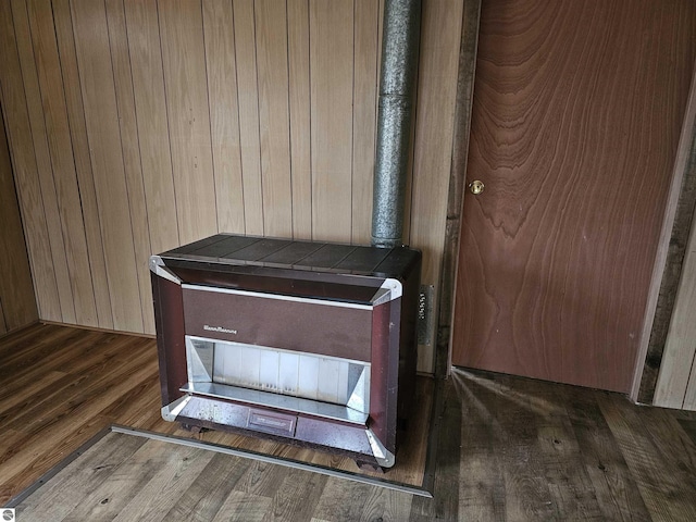 interior details featuring wooden walls and hardwood / wood-style flooring