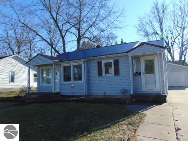 view of front of house featuring an outbuilding and a garage