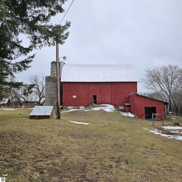 view of property exterior featuring a yard and an outdoor structure