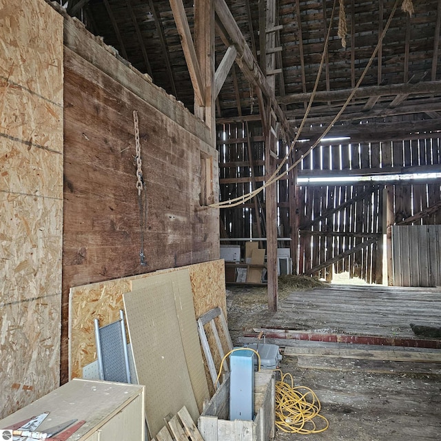 miscellaneous room with high vaulted ceiling