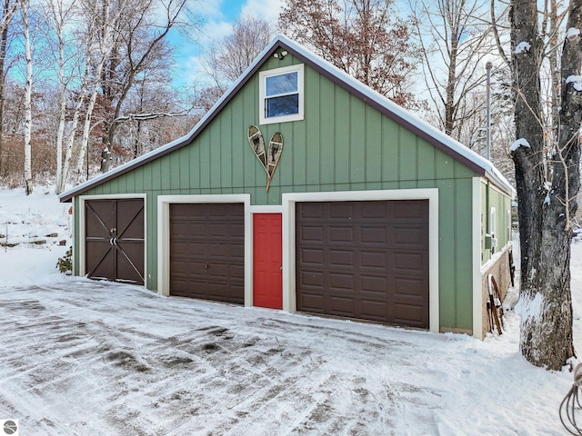 view of snow covered garage