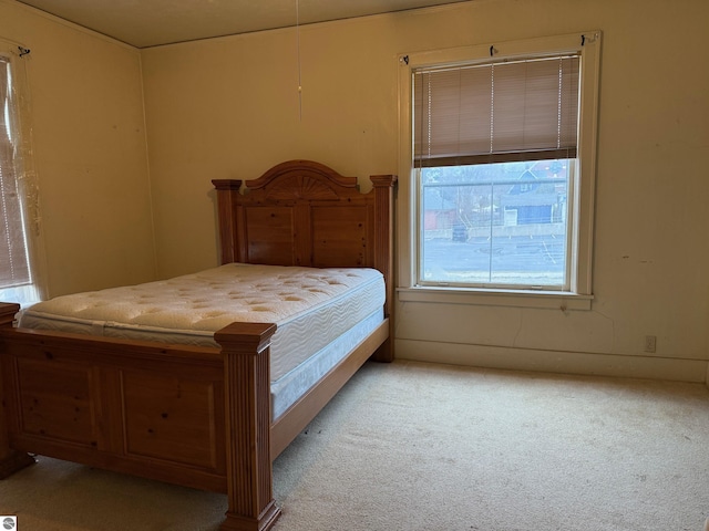 bedroom with light colored carpet