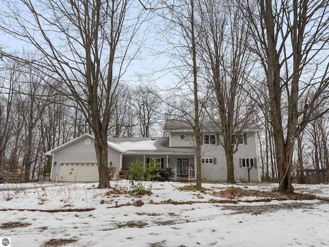 view of front of property featuring covered porch and a garage