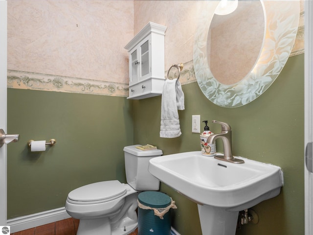 bathroom featuring sink and toilet