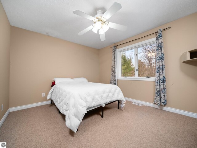 bedroom featuring carpet and ceiling fan