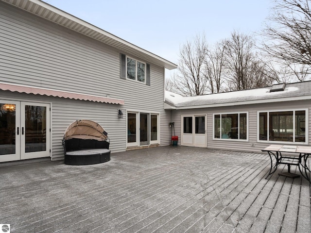 wooden deck featuring french doors