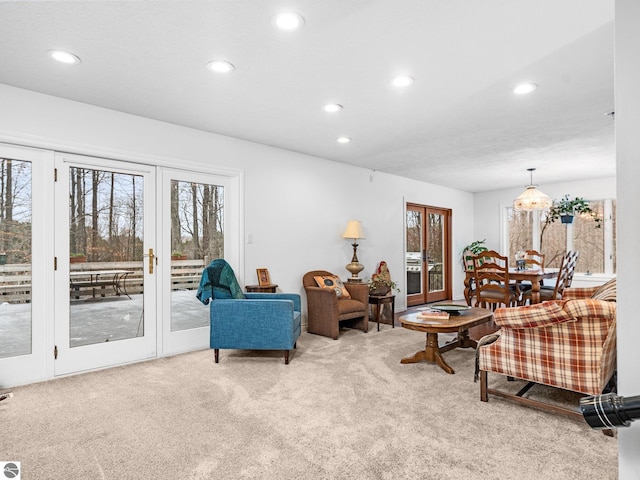 carpeted living room featuring french doors