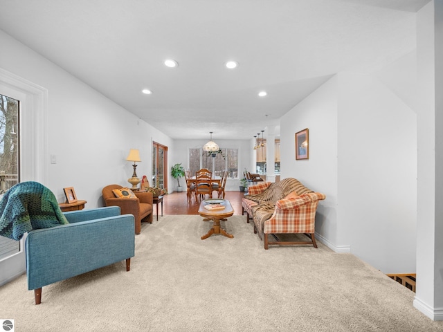 living room with light colored carpet and a wealth of natural light