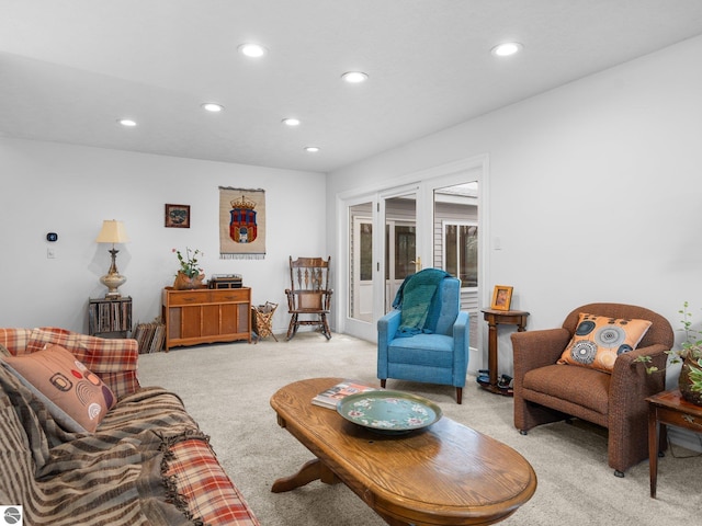 living room with french doors and light colored carpet