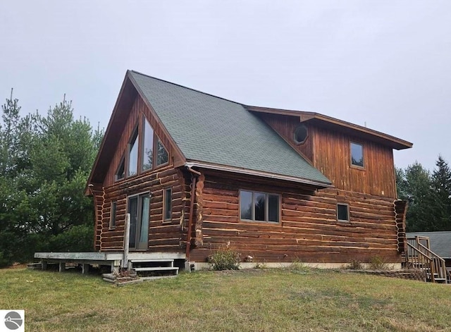 back of house featuring a yard