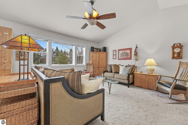 living room with light colored carpet, vaulted ceiling, and ceiling fan