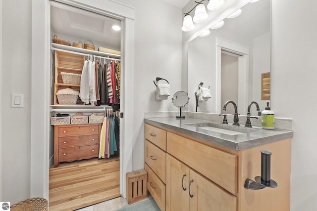 bathroom with hardwood / wood-style floors and vanity