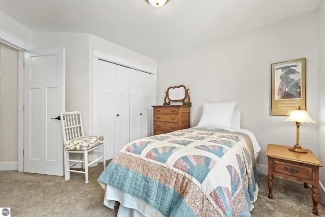 bedroom with light carpet and a closet