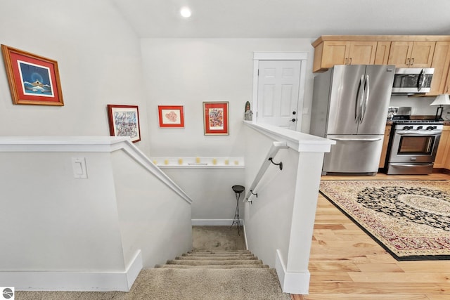 staircase featuring hardwood / wood-style flooring