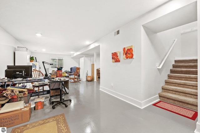 home office with concrete flooring