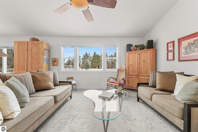 carpeted living room featuring ceiling fan, a wealth of natural light, and vaulted ceiling