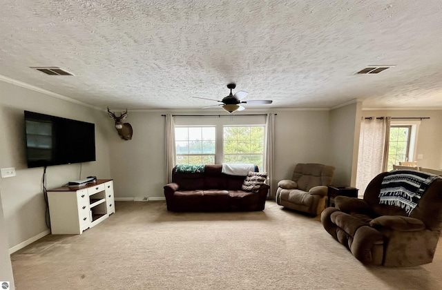 carpeted living room featuring a textured ceiling, ceiling fan, and ornamental molding