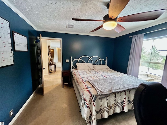 carpeted bedroom featuring ceiling fan, crown molding, and a textured ceiling