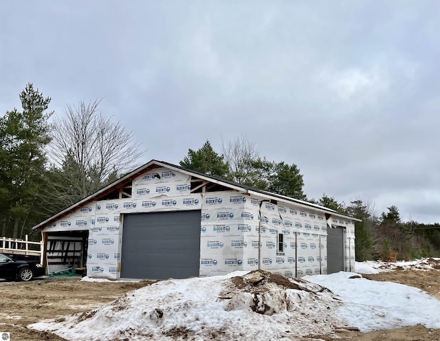 view of snow covered garage