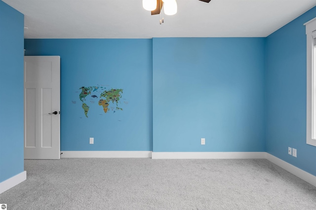 carpeted empty room with ceiling fan