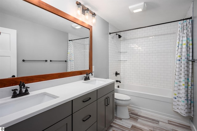 full bathroom with toilet, vanity, shower / bath combination with curtain, and wood-type flooring