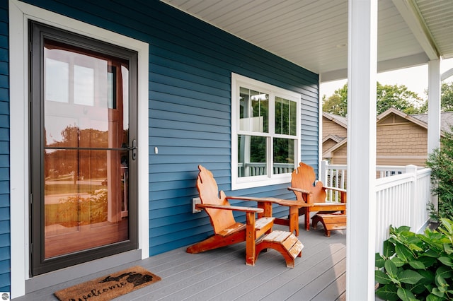 wooden terrace featuring a porch