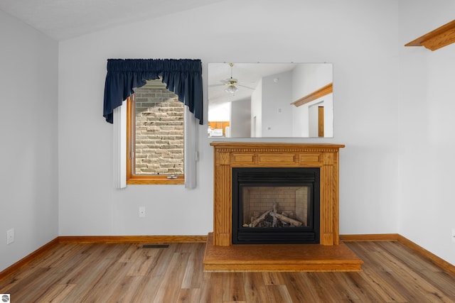 interior details featuring ceiling fan and hardwood / wood-style floors