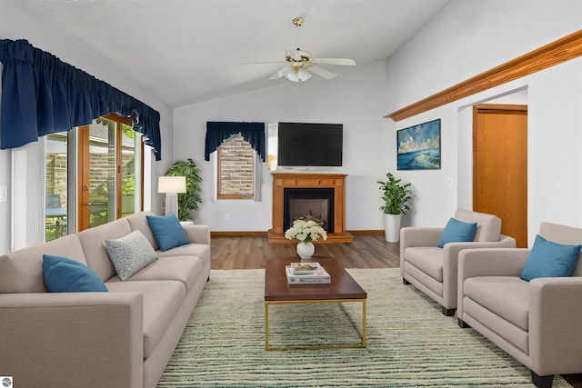 living room featuring wood-type flooring, vaulted ceiling, and ceiling fan