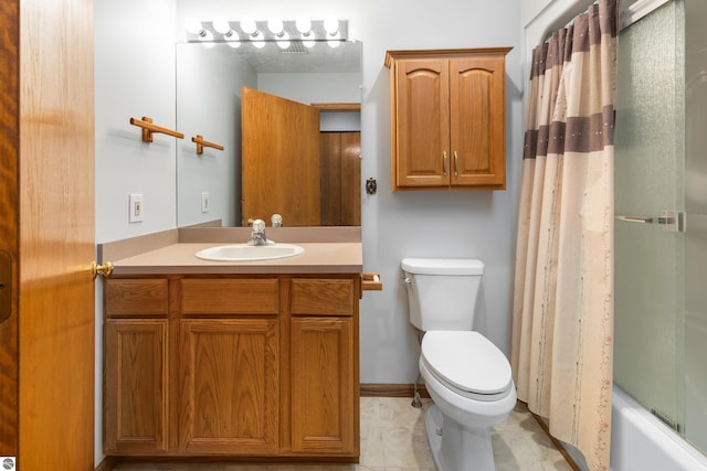 full bathroom featuring vanity, shower / bath combo, and toilet